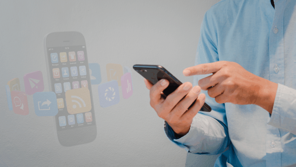A person in a light blue shirt is using a smartphone. To the left, app icons float from an illustrated smartphone, symbolizing mobile applications and digital connectivity-an approach often championed by marketing expert Neil Patel. VoiceDrop Ringless Voicemails