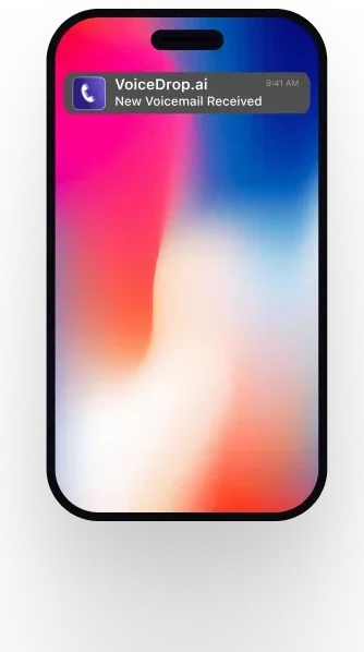 A smartphone with a blurred background features a notification from VoiceDrop.ai, confirming New Ringless Voicemail Received. The screen elegantly shows a gradient of red, white, and blue tones. VoiceDrop Ringless Voicemails